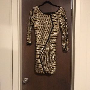 Black and gold sequin dress